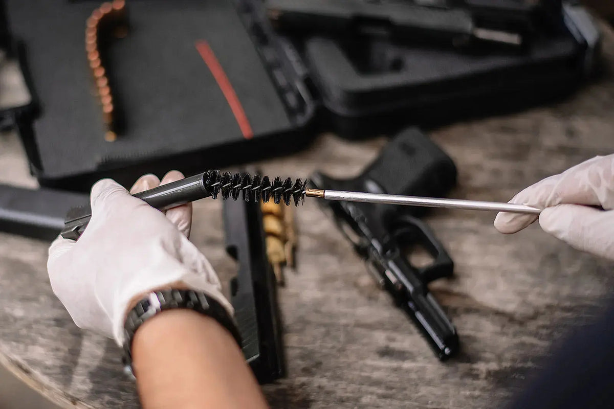 Gun owner cleaning a firearm as part of responsible ownership