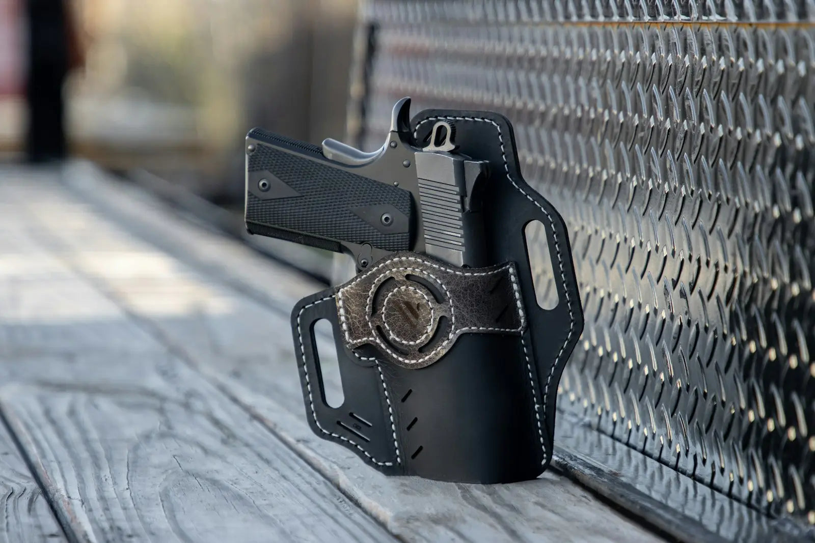 Police duty holster on a cleaning bench before weapon maintenance