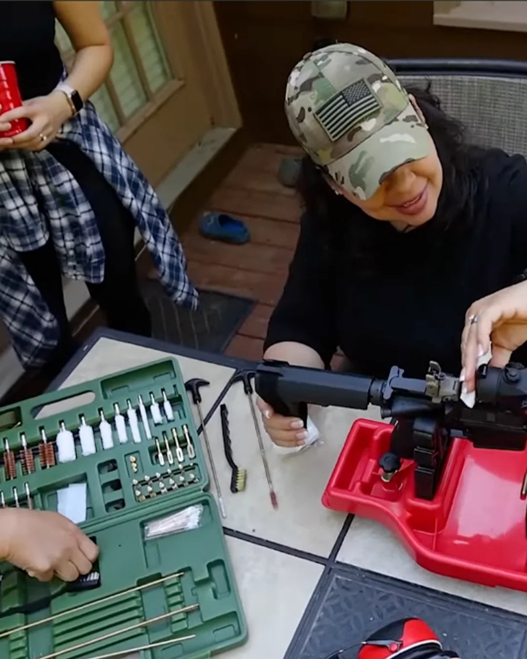 Gun cleaning demonstration with a green GuardTech Plus kit