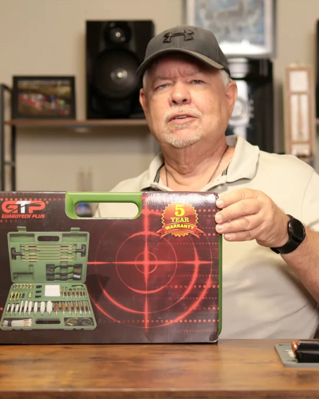 Customer displaying a GuardTech Plus gun cleaning kit