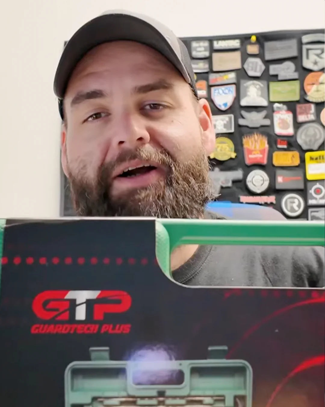 Customer presenting a GuardTech Plus gun cleaning kit